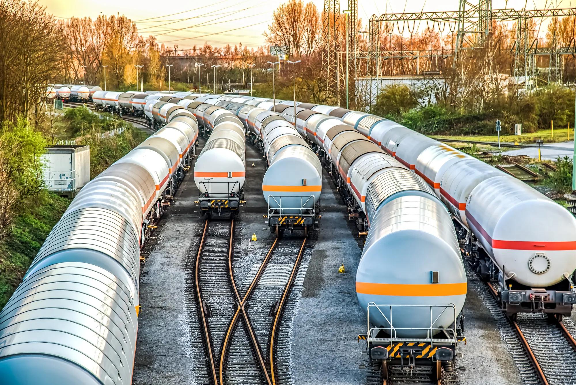 Freight train with petroleum tank-cars . terminal of freight cars . Transportation of liquid and dangerous goods by rail