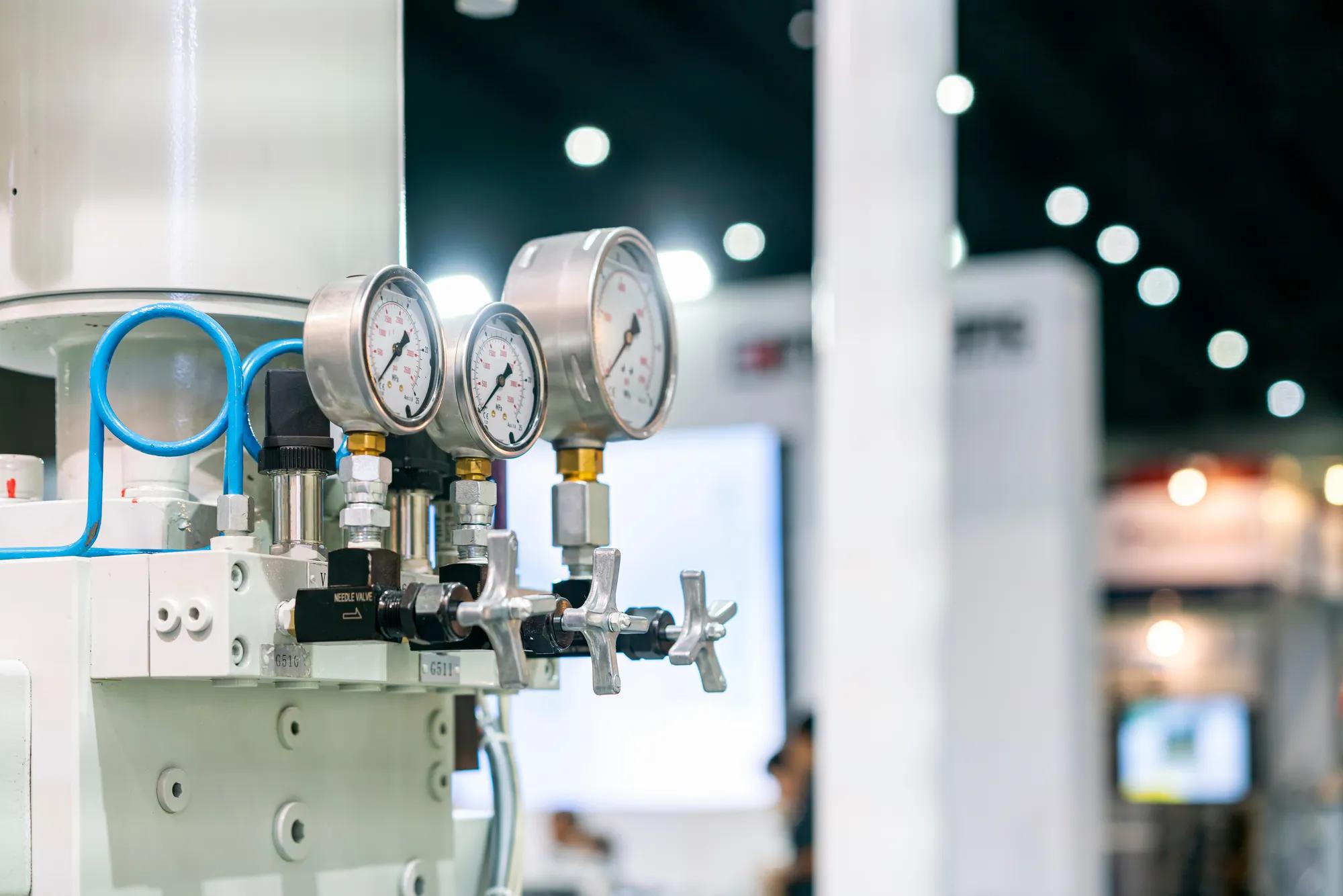 close up high accuracy and precision industrial pressure gauge with valve control for hydraulic system of machine