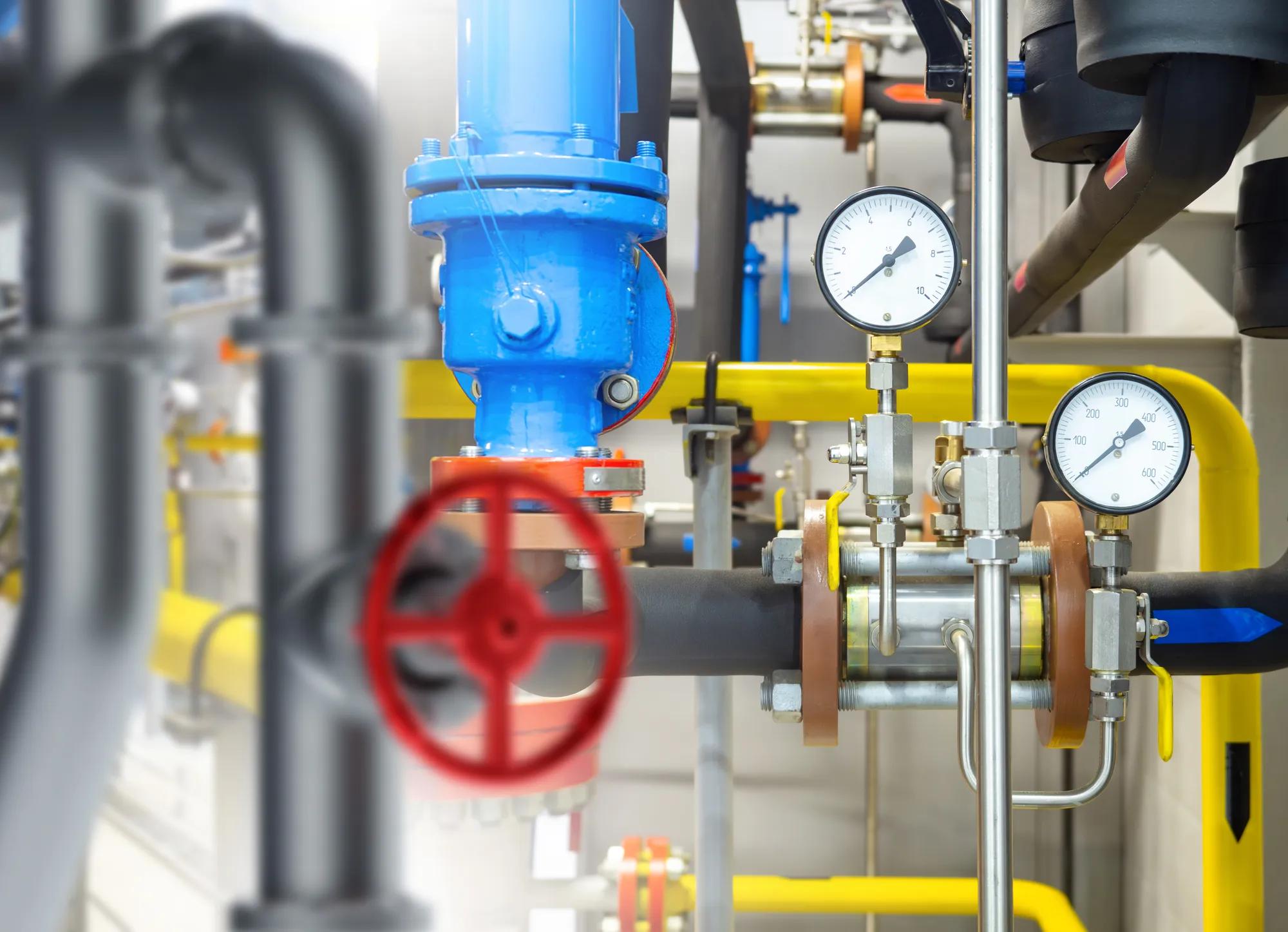 Industrial equipment. Boiler equipment pipes. Tangled gas pipeline. Pressure gauges for gas equipment. Boiler technologies. Pipes inside gas compressor station. Engineering communications enterprise