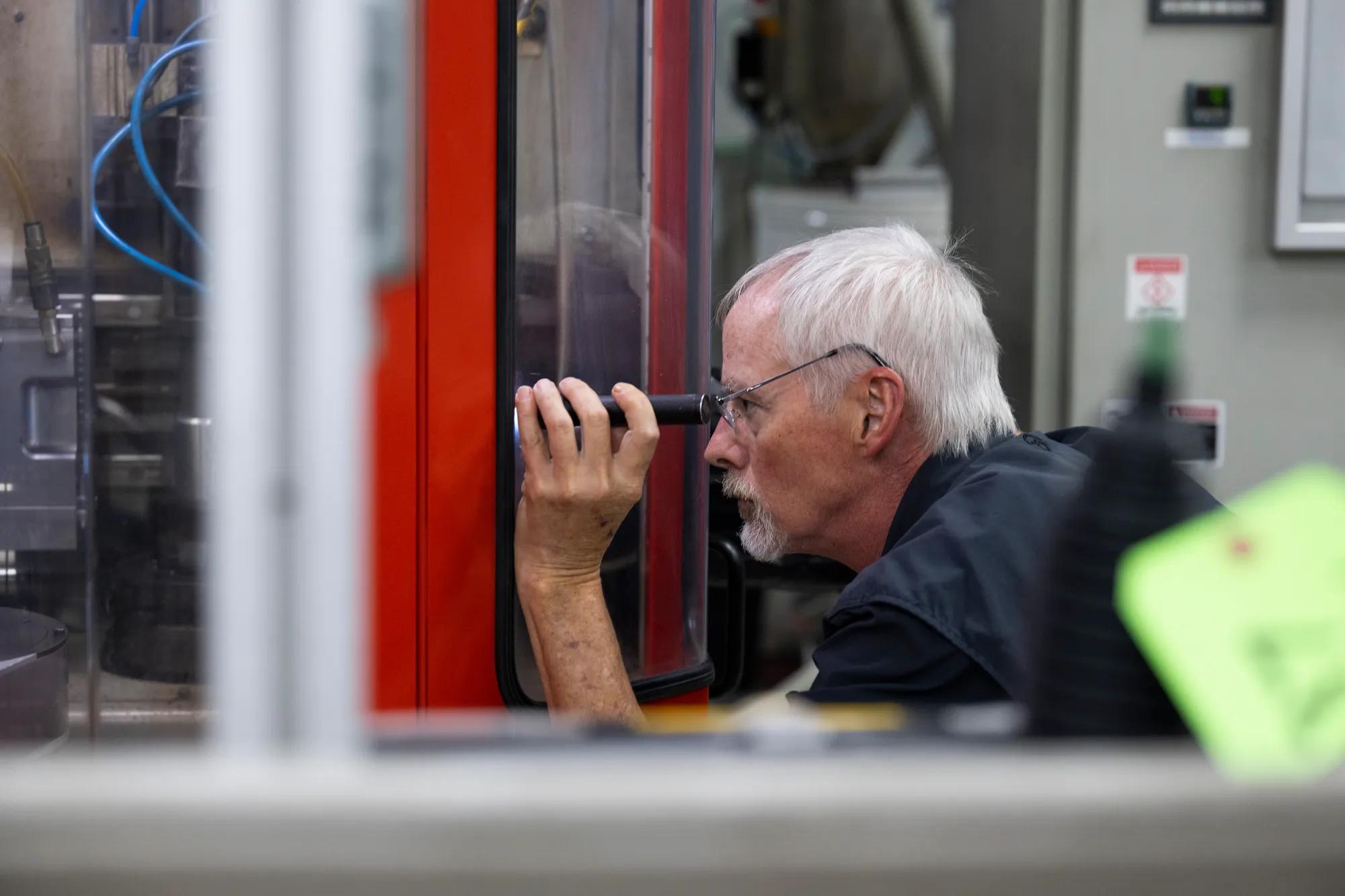 A Trelleborg Salisbury employee performs a rapid machine inspection during production.