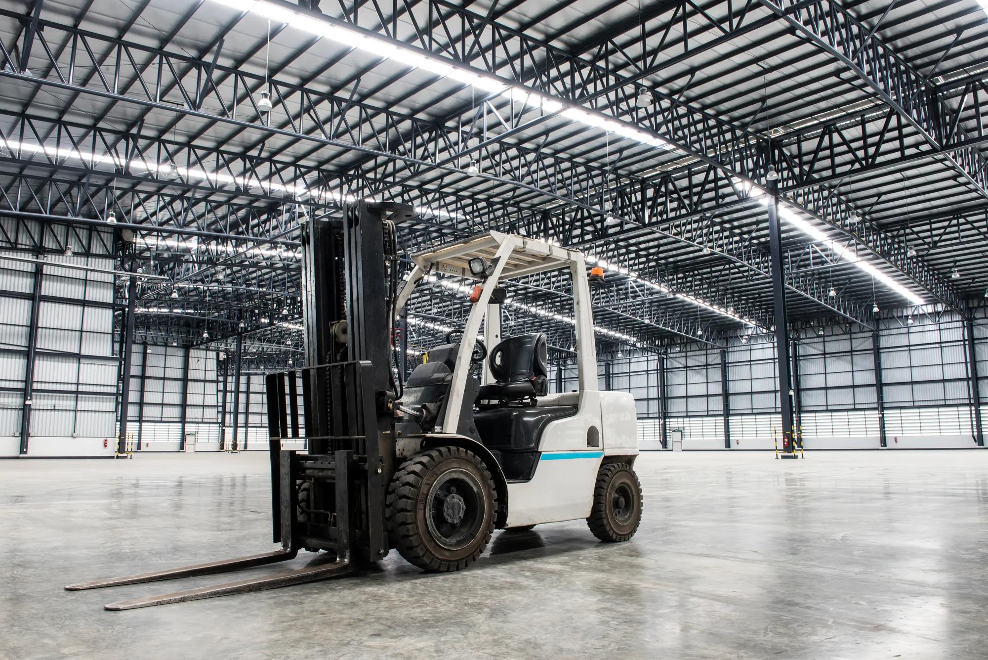Forklift loader in large modern storehouse