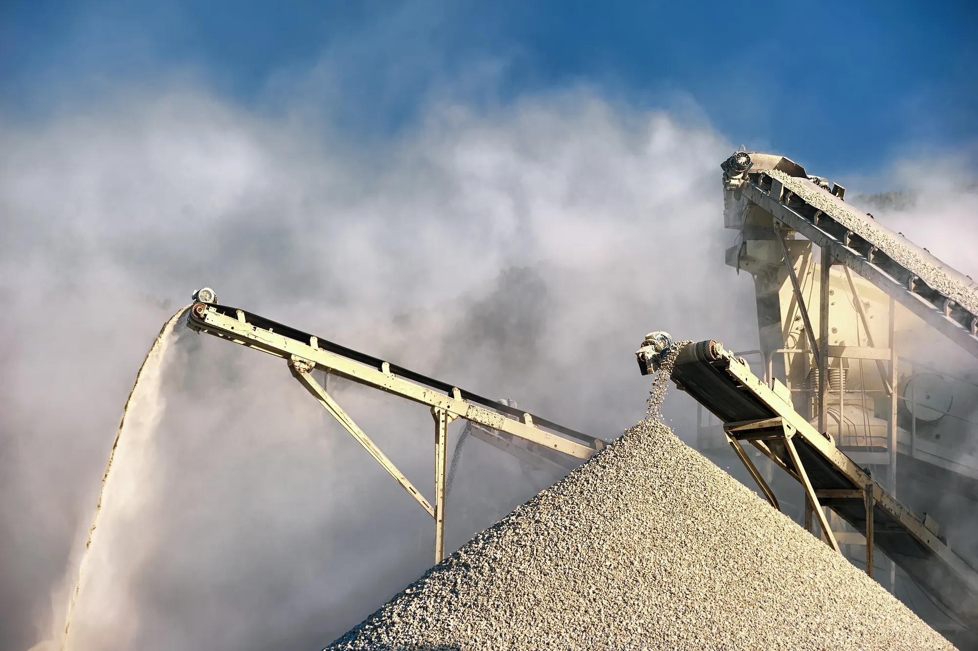 Smog and dirty dust air pollution industrial background on outdoor rock crushing and digging plant factory