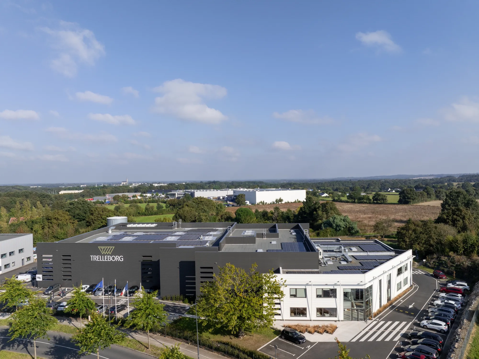 Areal view of the french production facility, with solar panels on the roof.