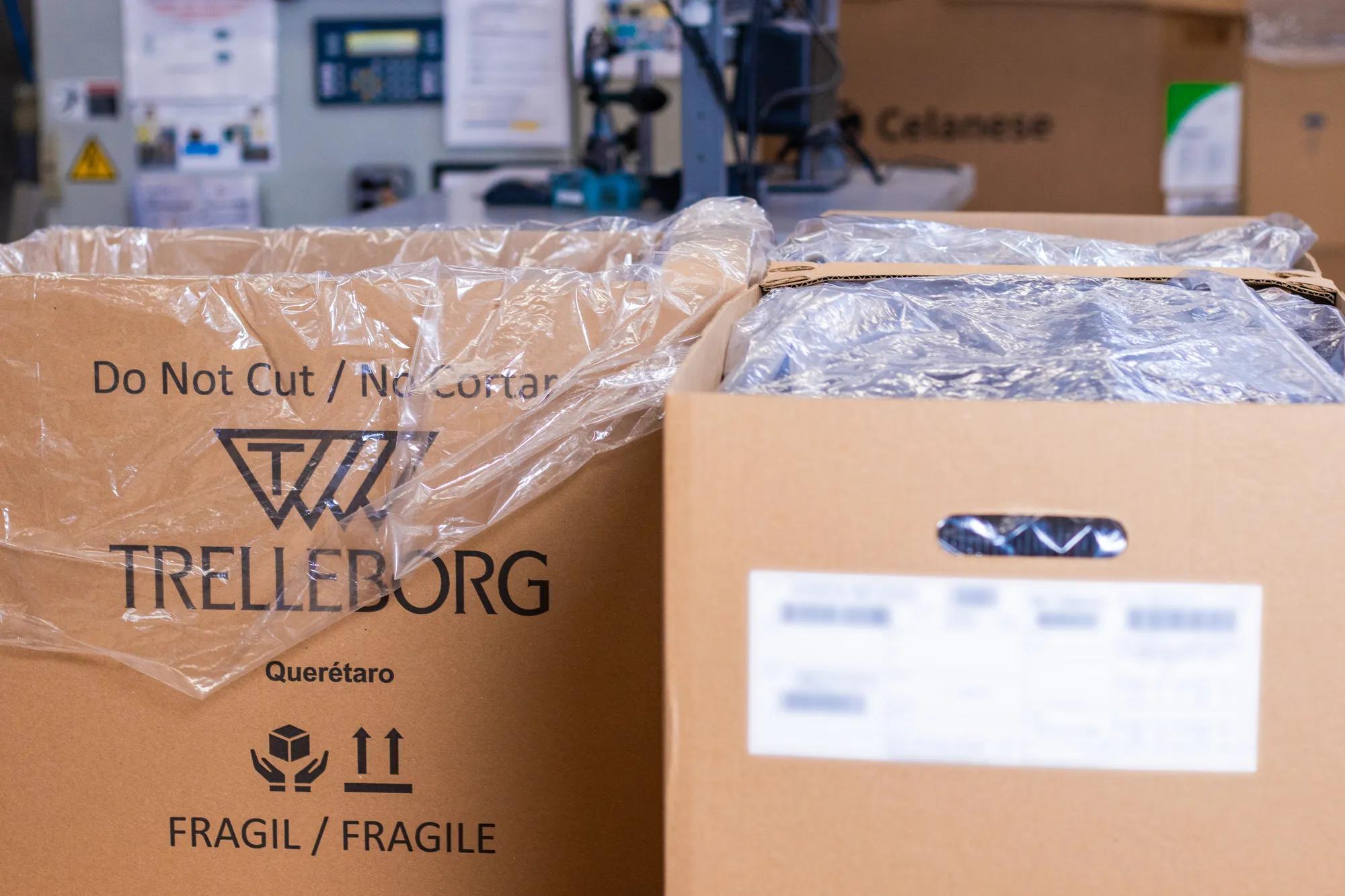 Cardboard boxes arranged in the production area, ready to be filled and used for packaging CVJ boots.