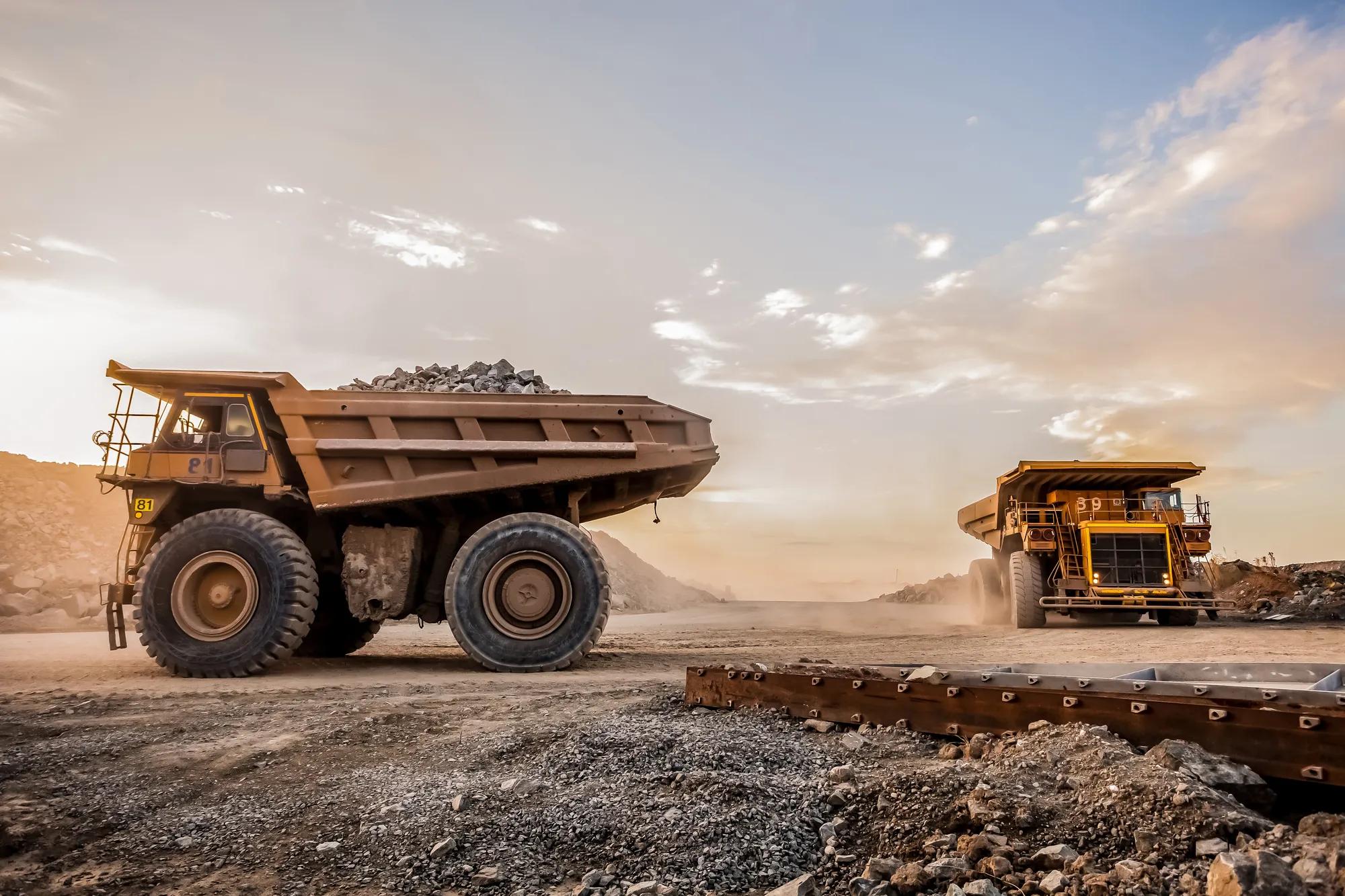 Dump Trucks transporting Platinum ore for processing