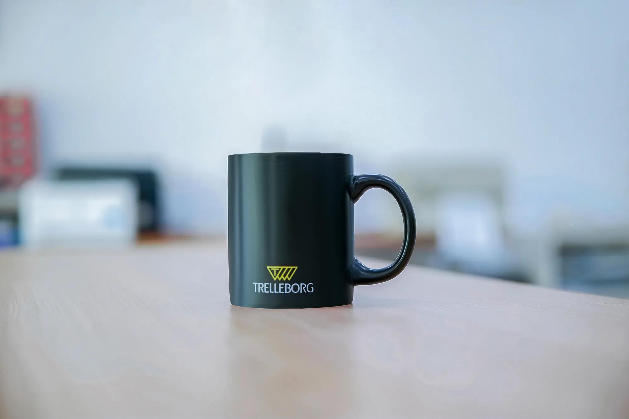 A Trelleborg branded coffee cup.