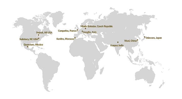 A grey and gold world map showing the global locations of Trelleborg Boots facilities and implementation sites.