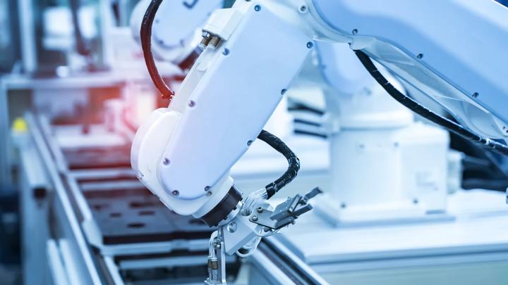 robotic arm catch for electronic assembly line. The robot for smart technology manufacturing process.