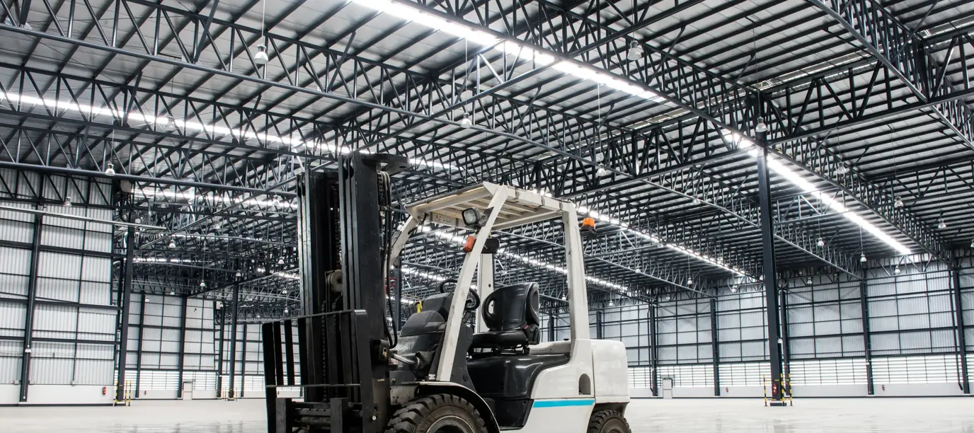 Forklift loader in large modern storehouse