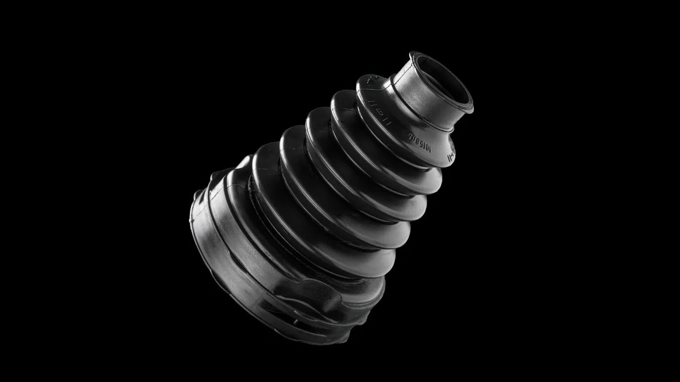 A CVJ trilobe boot showcased against a black background, highlighting the seamless and innovative design that replaces the traditional combination of a circular CVJ boot and adaptor.