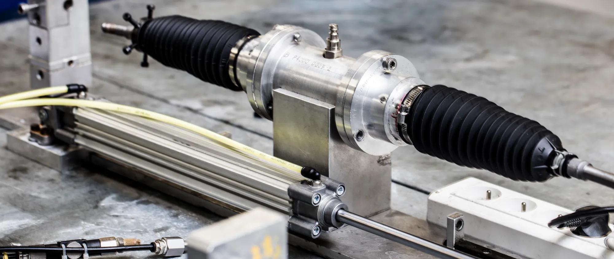A rack and pinion system positioned in the test bench area, ready for performance testing and validation.