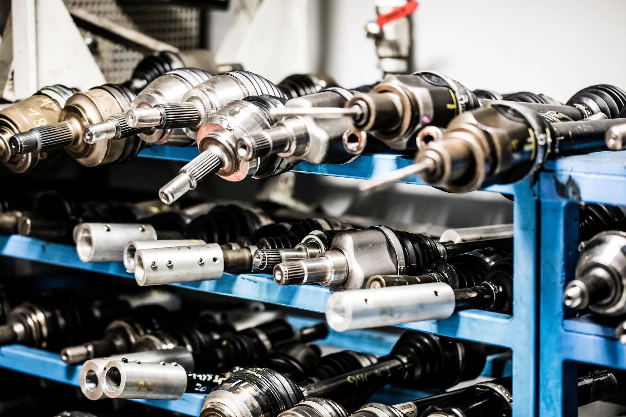 Multiple transmissions stored in the test bench area, ready to be used for testing and validating CVJ boots.