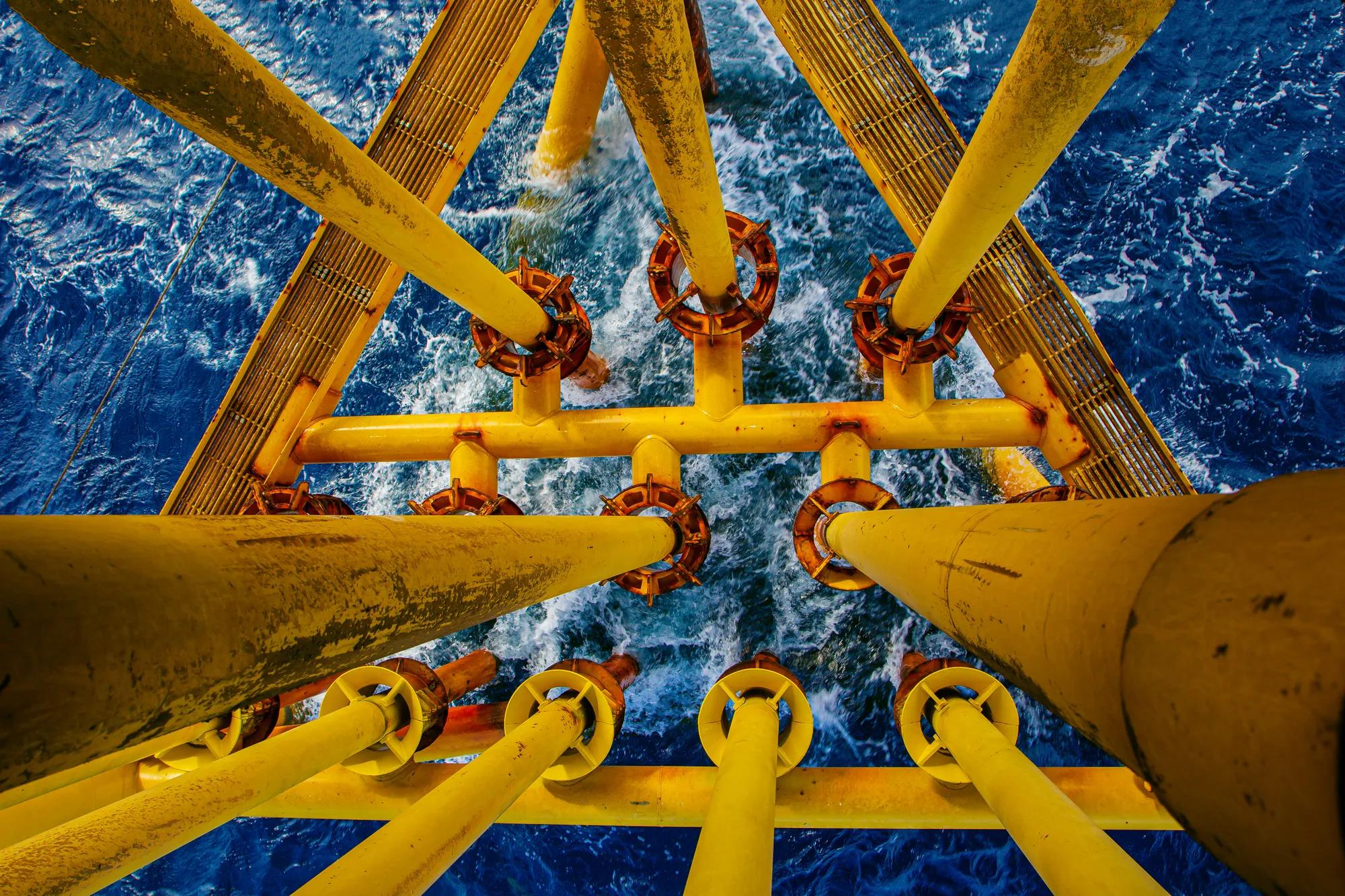 Offshore drill yellow oil and gas wave sea production petroleum pipeline.