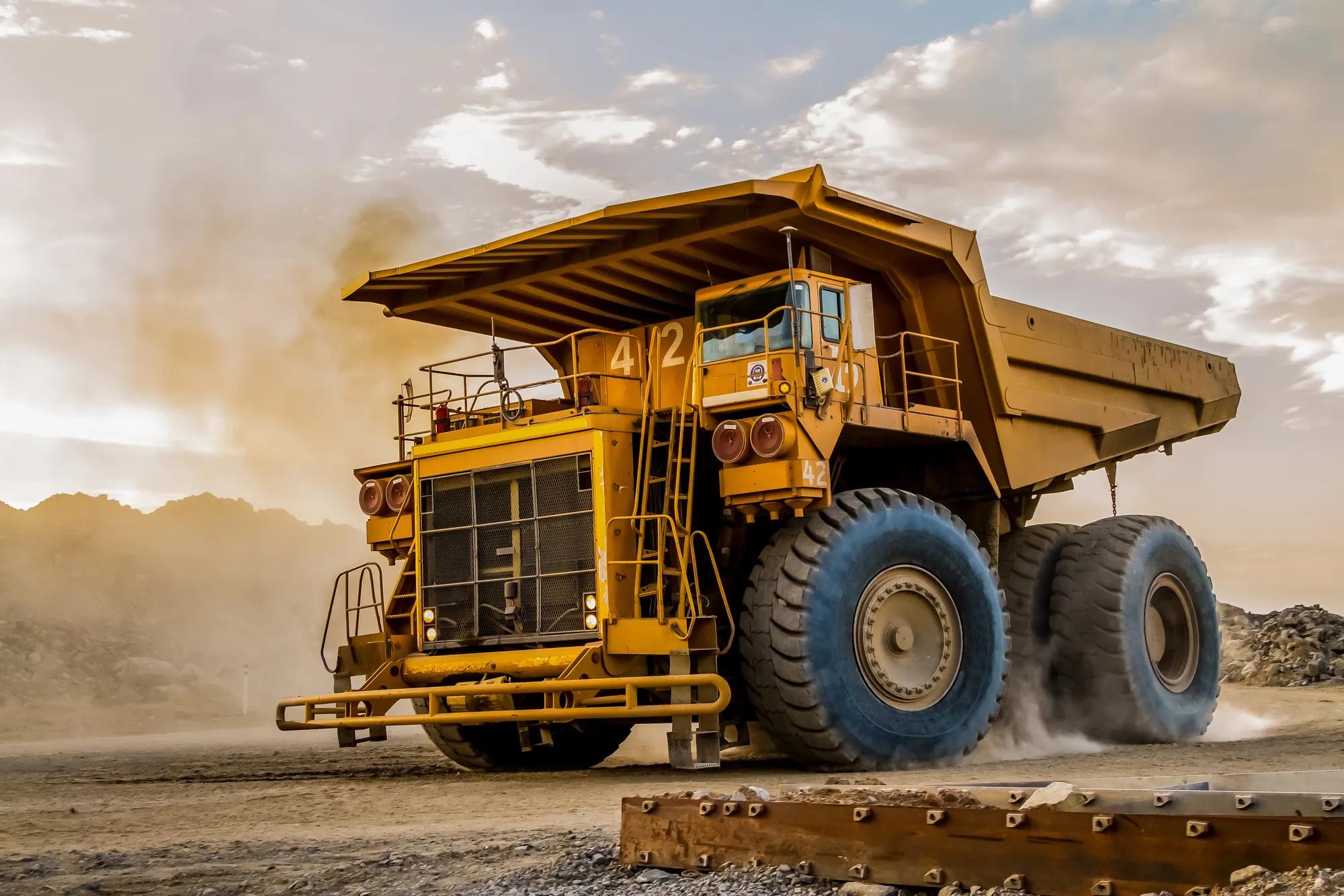 Dump Trucks transporting Platinum ore for processing